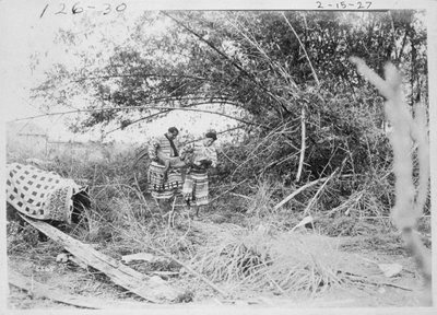 Seminole Indians with a captured alligator by American Photographer